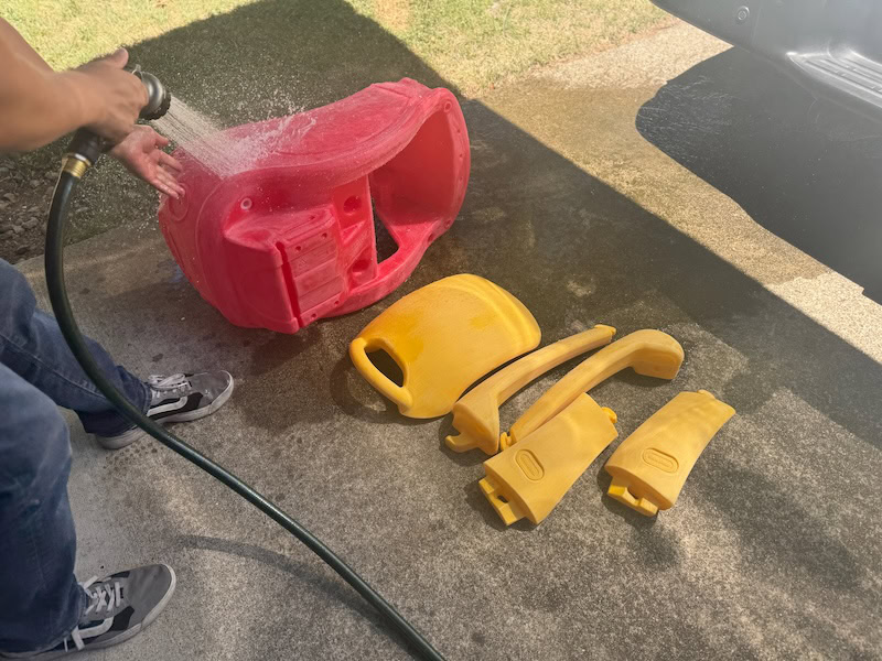 hosing down cozy coupe car