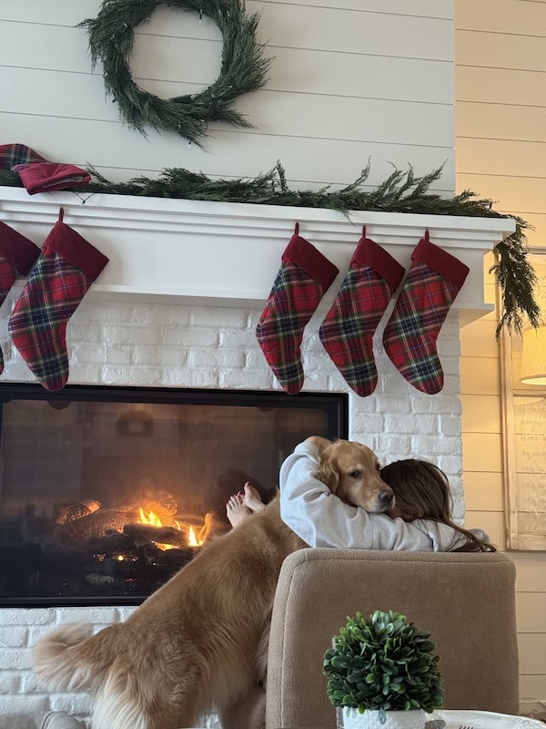 christmas stockings hanging over fireplace